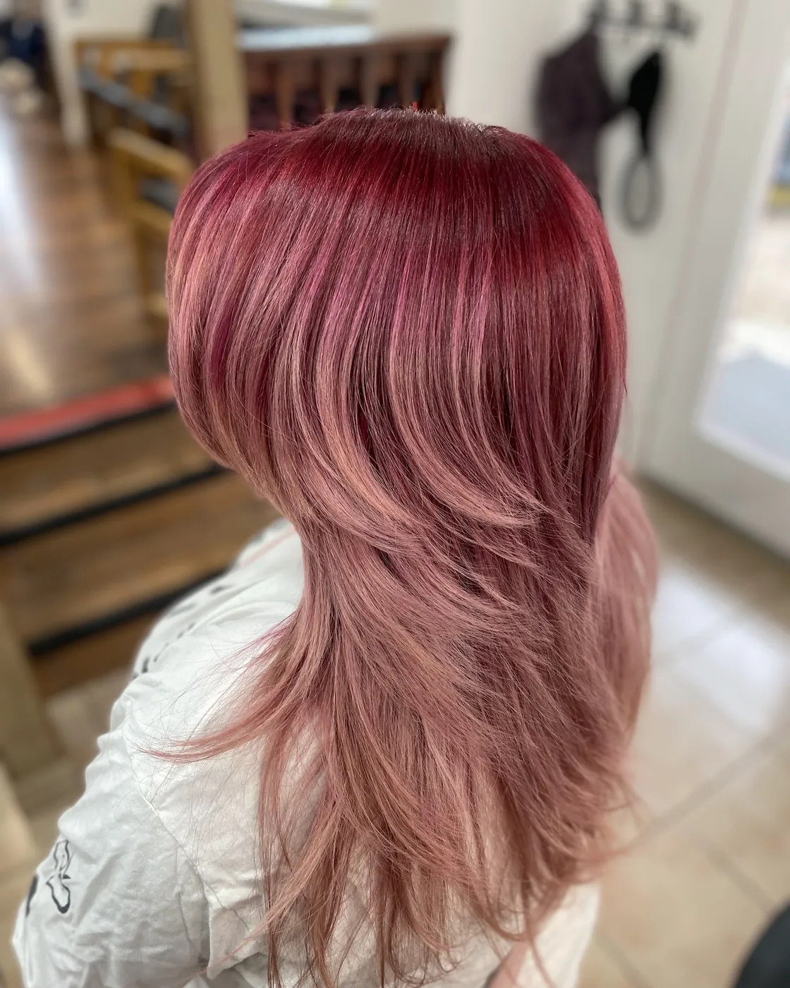Layered hair colored a deep rose red